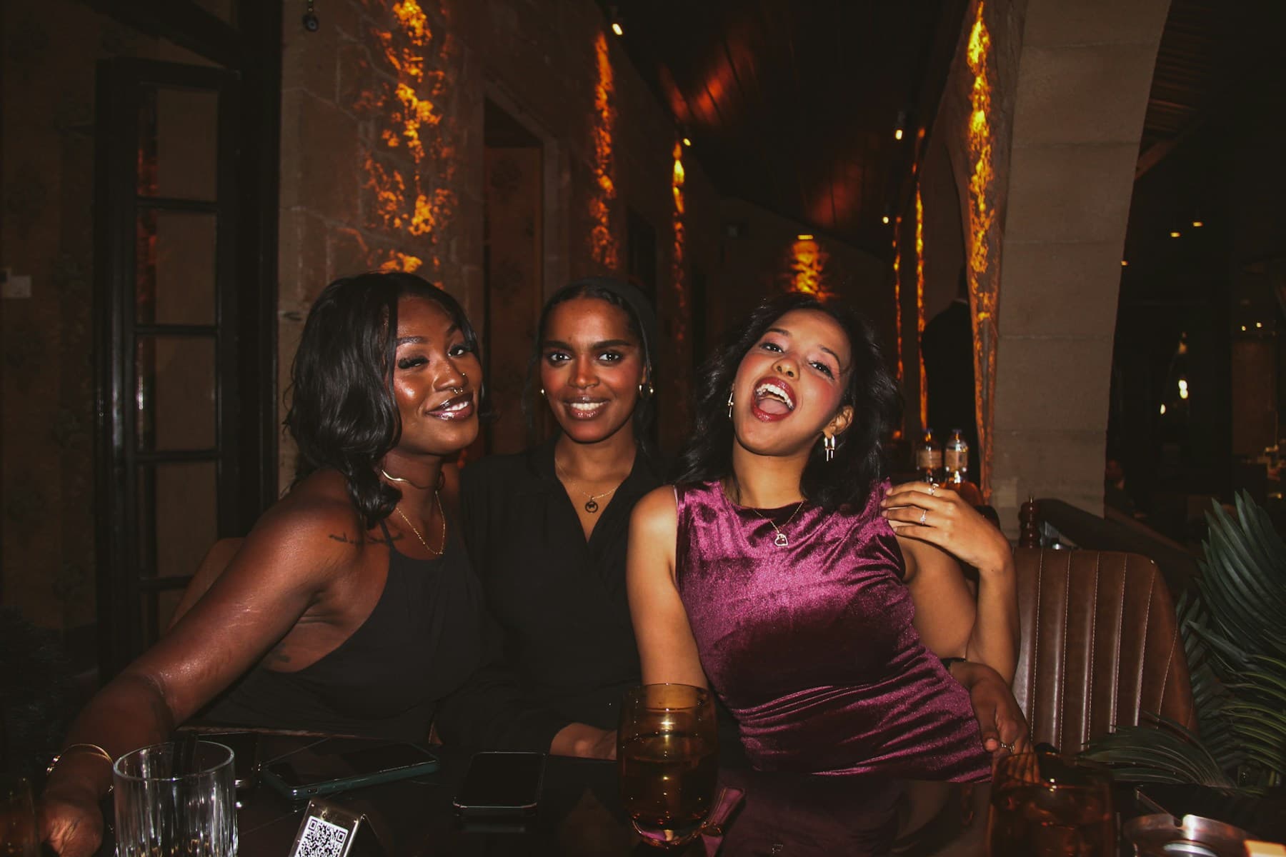 Friends laughing together over dinner